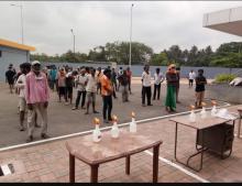 Precautionary measures adopted by the District Administration such as social Distancing, use of sanitizers etc during the process of transportation of migrants labourers to their native place at Fatorda Stadium, Margao-Goa.