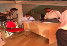 Dy. Collector & SDO, Salcete figuring out the list of migrants labourers to be transported to their native place at Fatorda Stadium Margao-Goa.