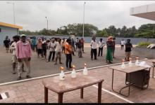 Precautionary measures adopted by the District Administration such as social Distancing, use of sanitizers etc during the process of transportation of migrants labourers to their native place at Fatorda Stadium, Margao-Goa.